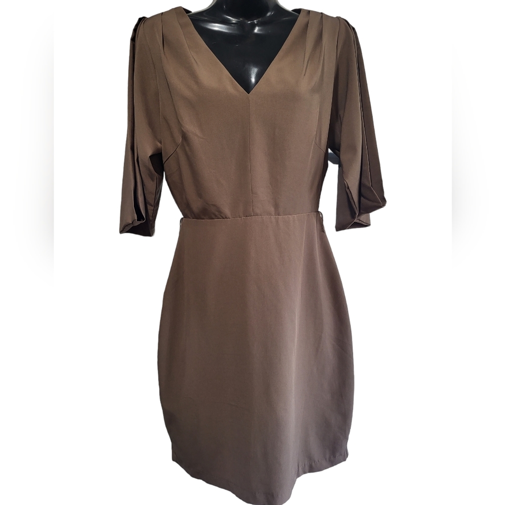 Woman's size S boutique dress with cutout back.